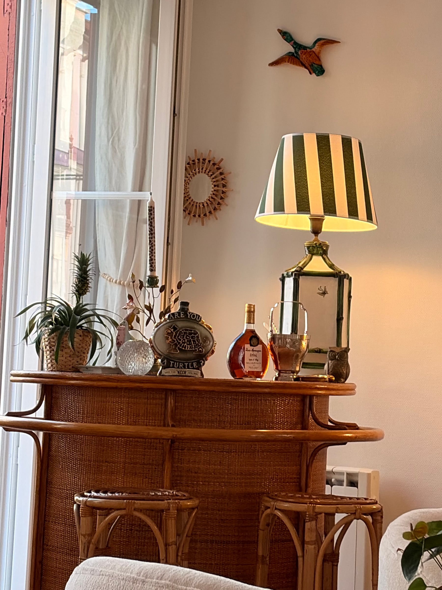 Bar top with striped lamp, lantern and decanter