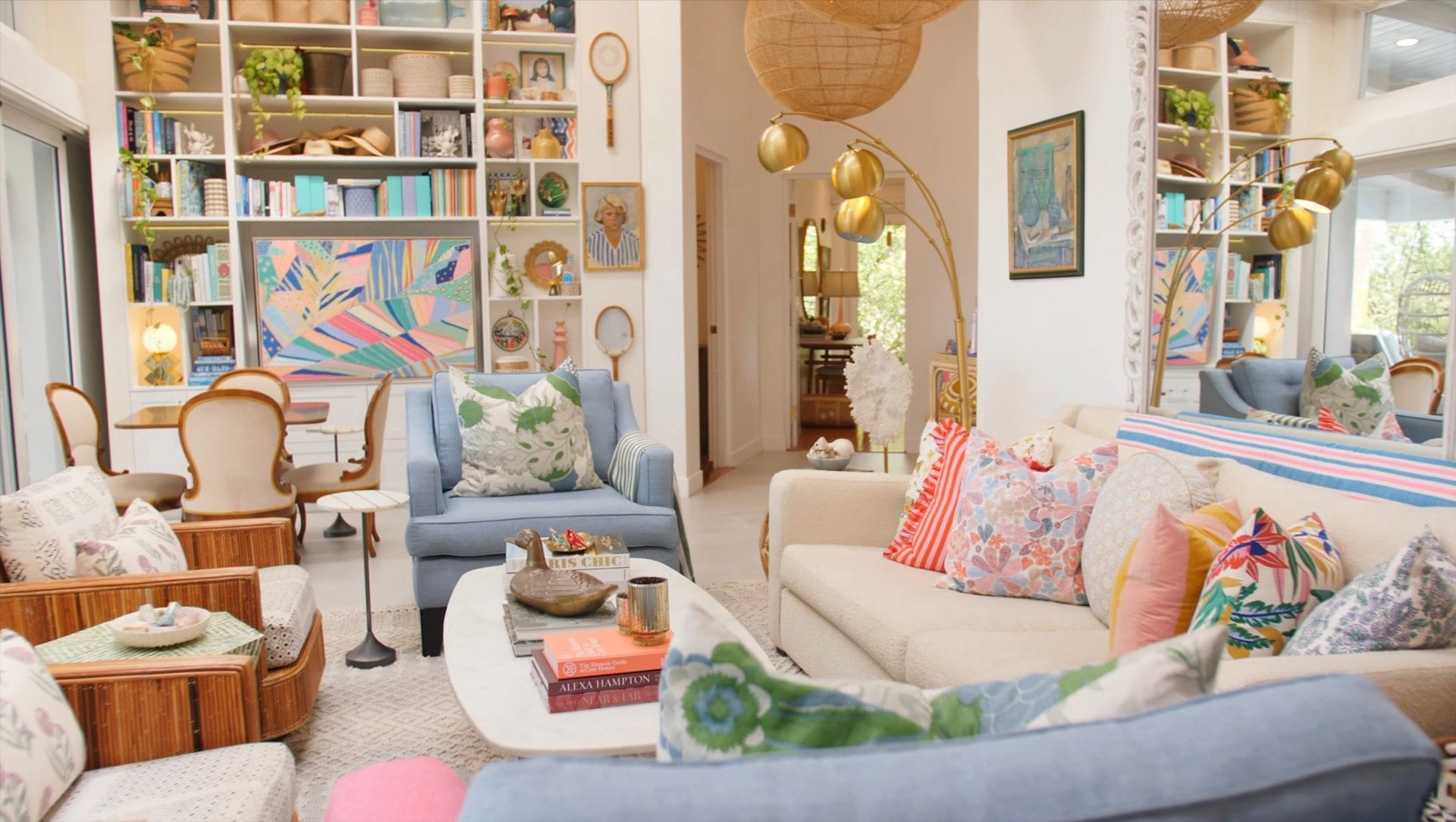 Bookshelf wall with armchairs