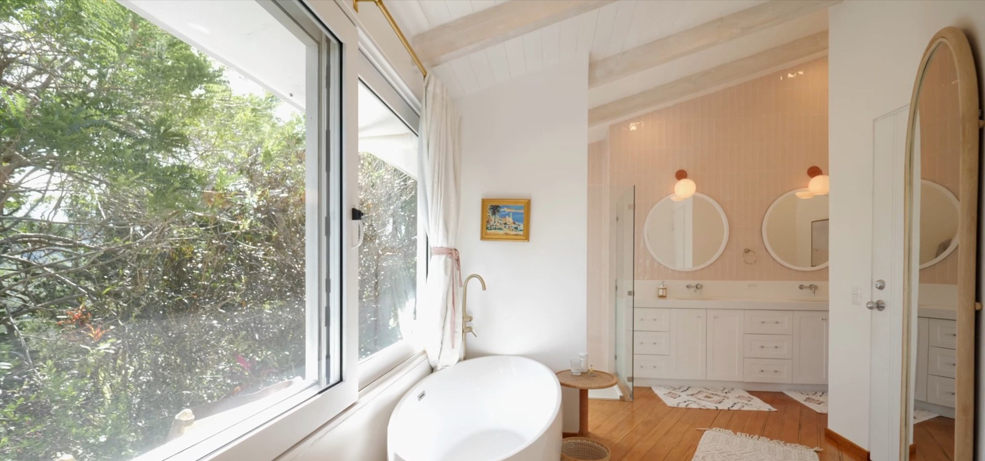 Ensuite with a soaking tub and glass shower