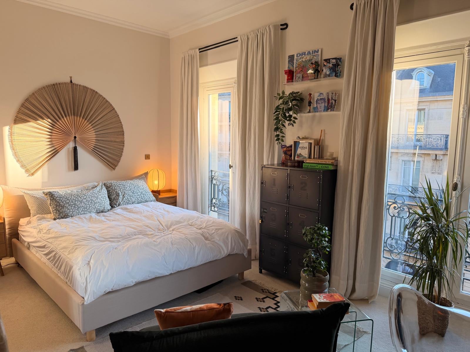 Bedroom window with balcony and black dresser